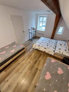 Postel nebo postele na pokoji v ubytování Apartmány Rudník Bolkov