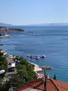 two boats in a large body of water at Apartment Ivanka in Senj