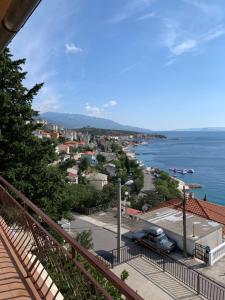 a view of a city and the ocean from a balcony at Apartment Ivanka in Senj