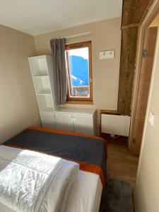 Postel nebo postele na pokoji v ubytování Avoriaz le M1212