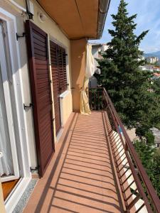 a balcony with a door and a christmas tree at Apartment Ivanka in Senj