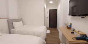 Letto o letti in una camera di 花蓮晨風星語民宿Sun Star B&B