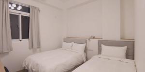 Letto o letti in una camera di 花蓮晨風星語民宿Sun Star B&B