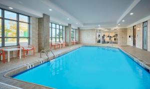 a large swimming pool in a hotel room at Holiday Inn & Suites Oakville at Bronte, an IHG Hotel in Oakville