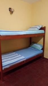 Ένα ή περισσότερα κρεβάτια σε δωμάτιο στο La Casa de Pedro Hostel