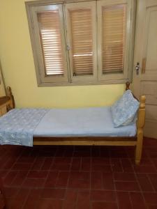 Ένα ή περισσότερα κρεβάτια σε δωμάτιο στο La Casa de Pedro Hostel