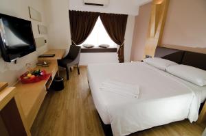 Postel nebo postele na pokoji v ubytování C'haya Hotel