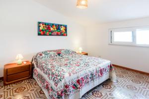 A bed or beds in a room at Splendida Villa con vista sull'Isola di Cirella