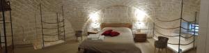 Postel nebo postele na pokoji v ubytování Le Vecchie Mura suite & room