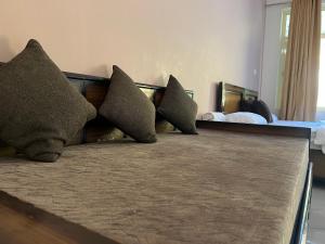 a row of pillows sitting on top of a bed at River Valley in Chamoli