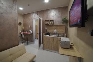 TV a/nebo společenská místnost v ubytování Hotel Marconi