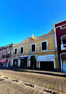 a building on the side of a street at Hotel Centro Historico in Puebla