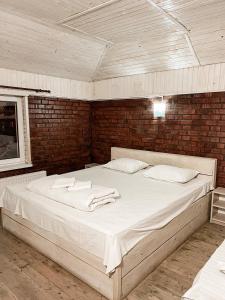 Posteľ alebo postele v izbe v ubytovaní Guest House Lviv