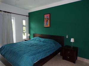 Ένα ή περισσότερα κρεβάτια σε δωμάτιο στο Luxury in the Caribbean