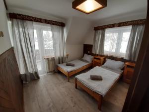 Postel nebo postele na pokoji v ubytování Na wierchu