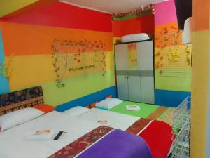 Letto o letti in una camera di Pelemkecut Double-Degree Syariah Accommodation