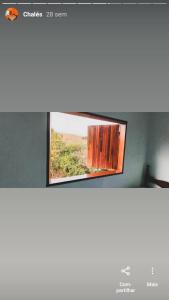 a mirror on a wall in a room at Pousada e Restaurante Boia Cross in Vargem Bonita +56 photos