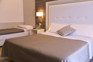 Postel nebo postele na pokoji v ubytování Hotel Crystal