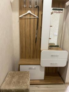 a bathroom with a sink and a mirror at Уютные апартаменты на Трехсвятской in Tver