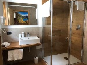 a bathroom with a sink and a shower at B&B el Benel in Ossana +29 photos