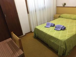 מיטה או מיטות בחדר ב-Hotel La Argentina