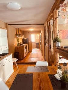 a living room with a kitchen and a dining room at Appartement 44 in Burrweiler