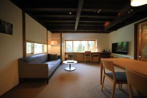 a living room with a couch and a table at Kamakura COCON in Kamakura