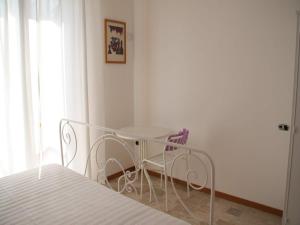 A bed or beds in a room at Cristina B&B