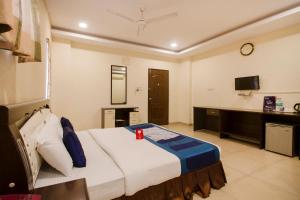 a hotel room with a bed and a tv at Way Inns in Hyderabad