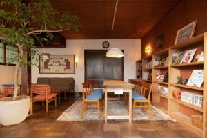 a dining room with a table and chairs at Ryokan Plum in Odawara