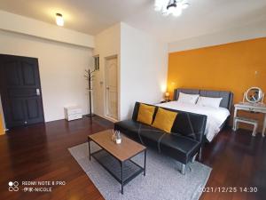 Postel nebo postele na pokoji v ubytování 伊家民宿Yi home 志航路一段398號