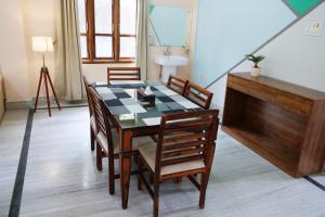 a dining room with a table and chairs at JOY'S BNB in Imphal