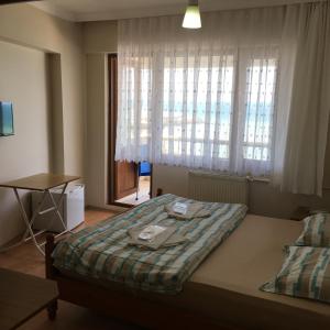 Postel nebo postele na pokoji v ubytování KOÇAN OTEL Hatice Karakoçan