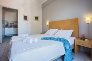 A bed or beds in a room at Argo Pension