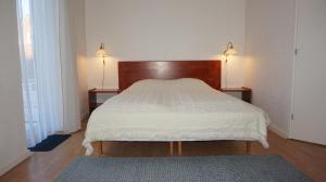 A bed or beds in a room at Børglum Mejeri Hotel