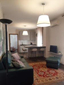 a living room with a couch and a table at Residenza San Felice in Vicenza