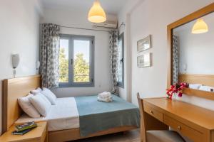 A bed or beds in a room at Argo Pension