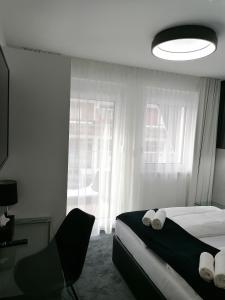 Łóżko lub łóżka w pokoju w obiekcie The Place Boutique & Design Hotel Flachau