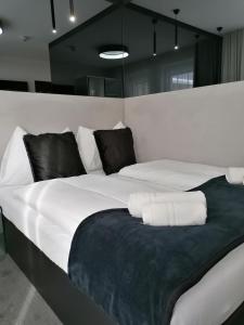 Łóżko lub łóżka w pokoju w obiekcie The Place Boutique & Design Hotel Flachau