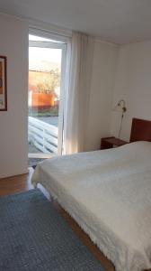 A bed or beds in a room at Børglum Mejeri Hotel