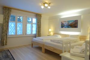 Postel nebo postele na pokoji v ubytování Chalet Surselva