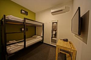 Postel nebo postele na pokoji v ubytování Tulip Hotel
