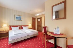 Postel nebo postele na pokoji v ubytování Akzent Aktiv & Vital Hotel Thüringen
