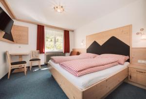 Postel nebo postele na pokoji v ubytování Berghotel Bodenalpe