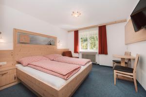 Postel nebo postele na pokoji v ubytování Berghotel Bodenalpe