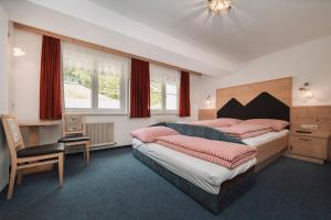 Postel nebo postele na pokoji v ubytování Berghotel Bodenalpe