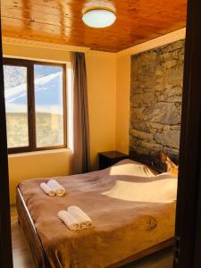 A bed or beds in a room at River side SVANETI