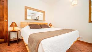 Postel nebo postele na pokoji v ubytování Hotel Luna Llena