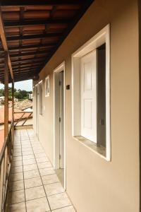 an open door on the side of a house at Roncador Suítes in Lençóis