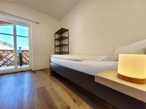 Łóżko lub łóżka w pokoju w obiekcie Ferienwohnung Flachau Oberlehengut